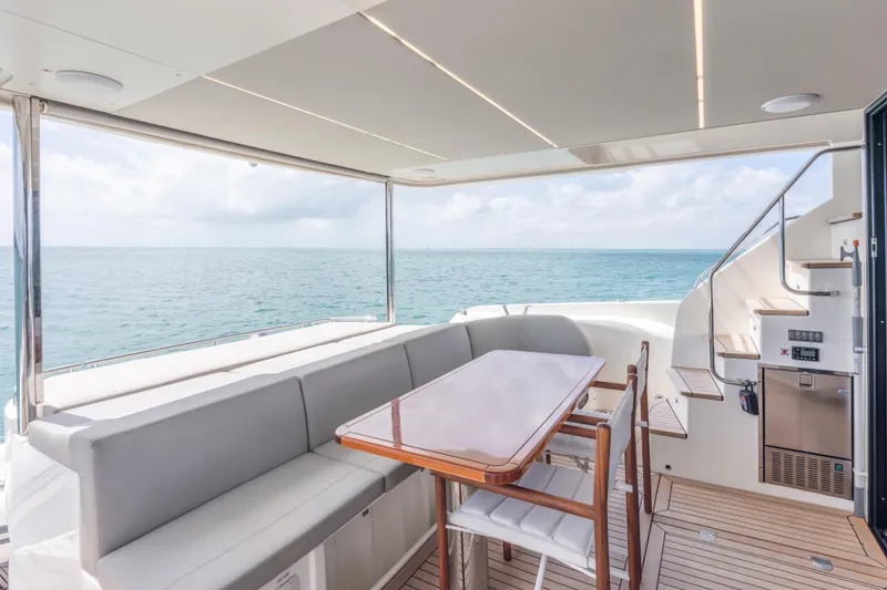 Slide: The Image of Luxurious 2019 Absolute 58 FLY yacht interior with ocean view and elegant seating area. - 41
