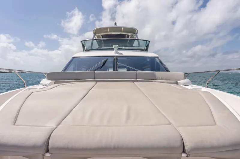 Slide: The Image of 2019 Absolute 58 FLY yacht with spacious sun deck on open water. - 43