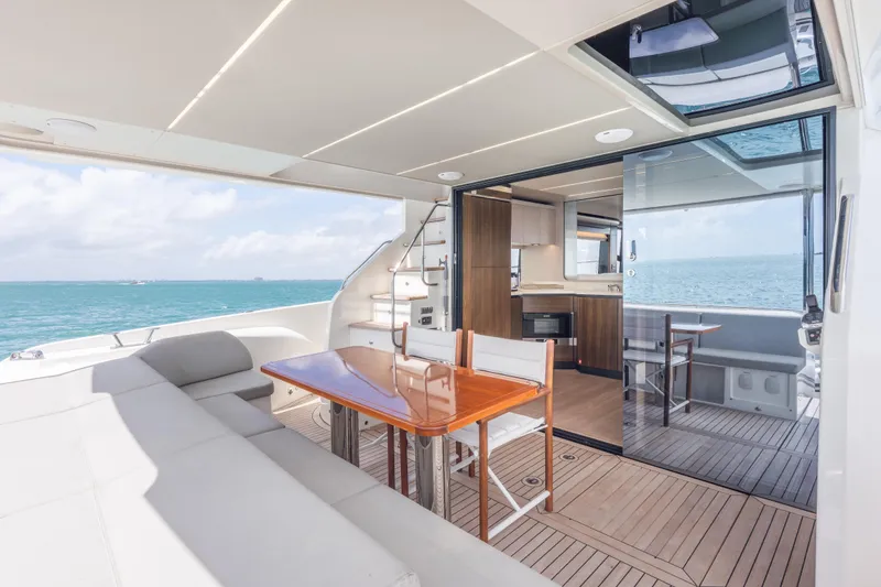 Slide: The Image of Luxurious 2019 Absolute 58 FLY yacht interior with elegant dining area and ocean view. - 45