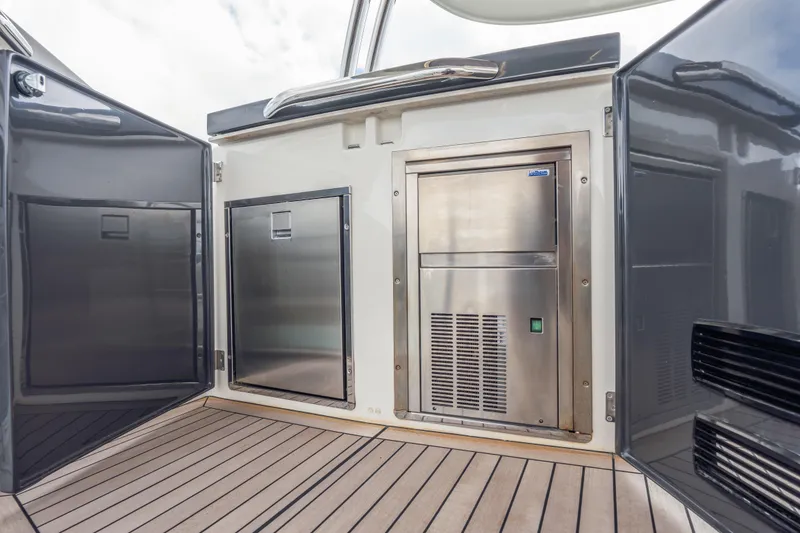 Slide: The Image of Luxury yacht Absolute 58 FLY 2019, featuring sleek stainless steel appliances on deck. - 50