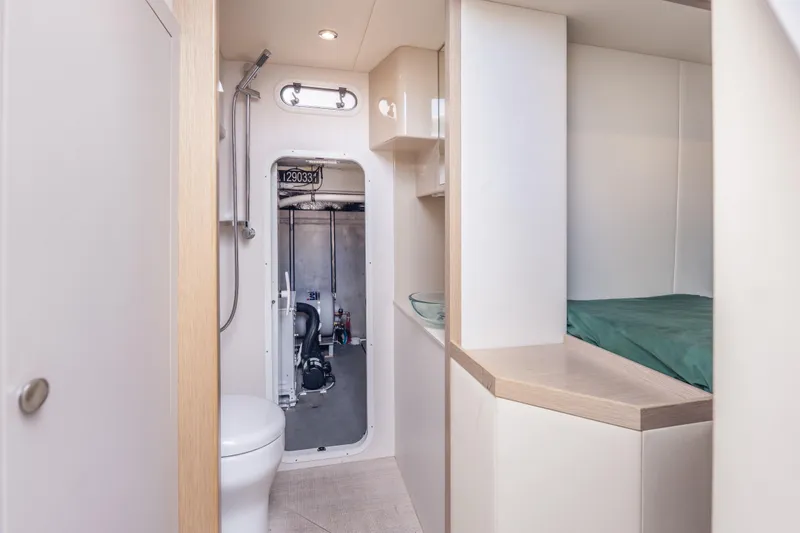 Slide: The Image of Interior of 2019 Absolute 58 FLY yacht featuring bathroom and sleeping area. - 53