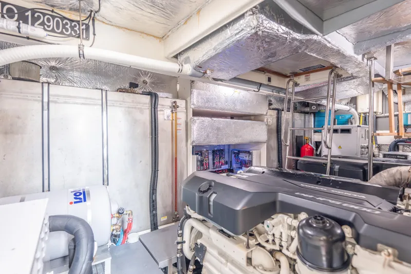 Slide: The Image of Engine room of 2019 Absolute 58 FLY yacht, featuring advanced machinery and equipment. - 55