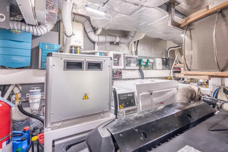 Slide: The Image of Engine room of 2019 Absolute 58 FLY yacht with Cummins Onan generator. - 57