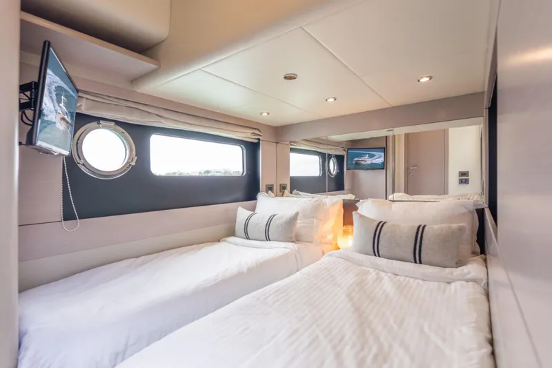 Slide: The Image of Luxurious cabin interior of 2019 Absolute 58 FLY yacht with twin beds and modern decor. - 59