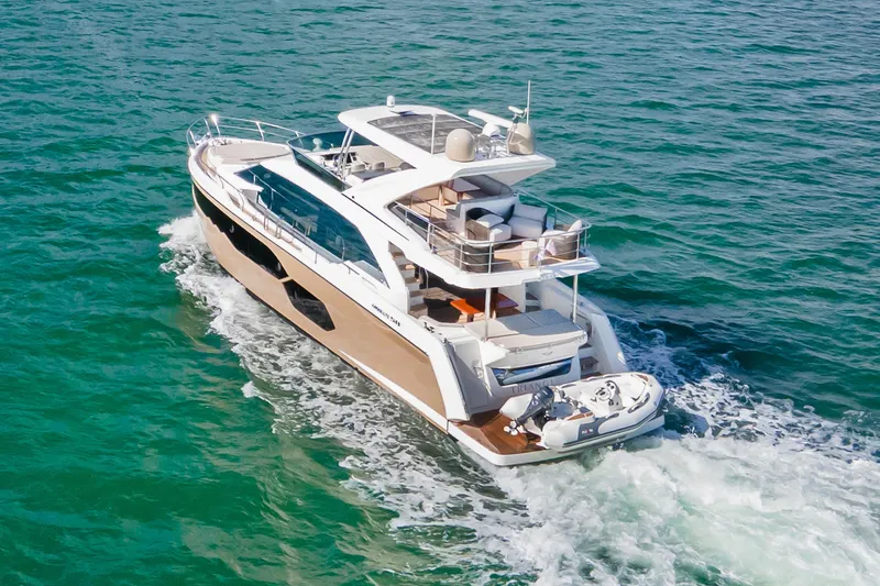 Slide: The Image of Luxurious 2019 Absolute 58 FLY yacht cruising on open water. - 7