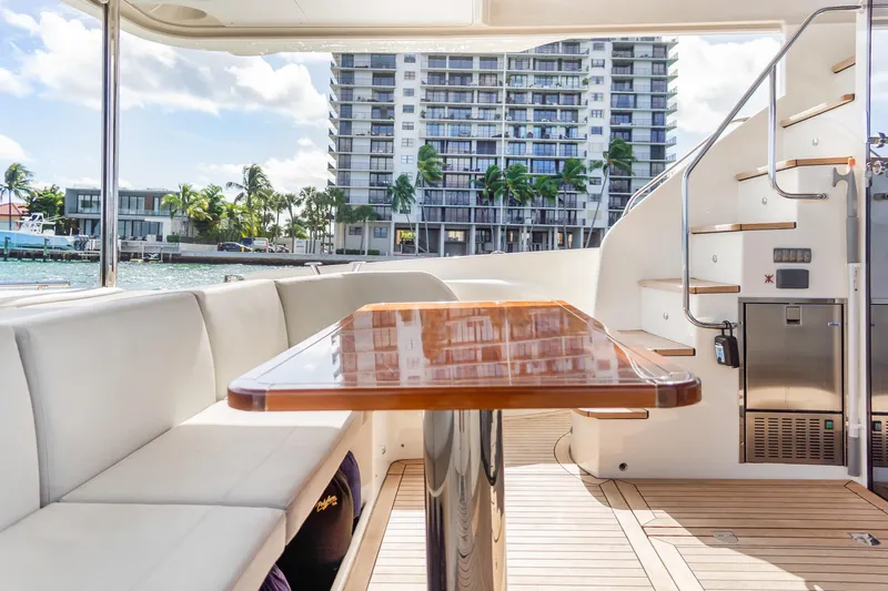 Slide: The Image of Luxurious 2019 Absolute 58 FLY yacht interior with elegant seating and wooden table. - 9