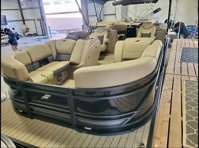 Slide: The Image of 2022 Starcraft SLS3 Tritoon with luxurious interior in warehouse. - 0