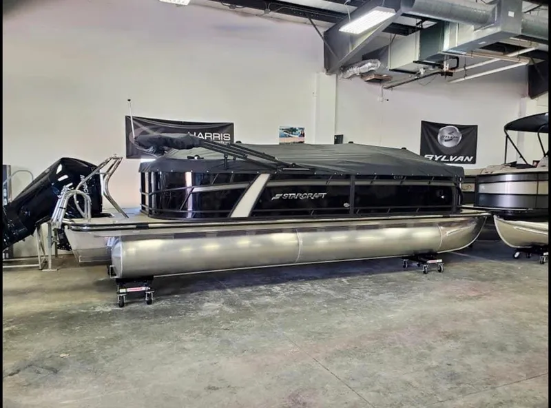 Slide: The Image of 2022 Starcraft SLS3 Tritoon in showroom. - 1