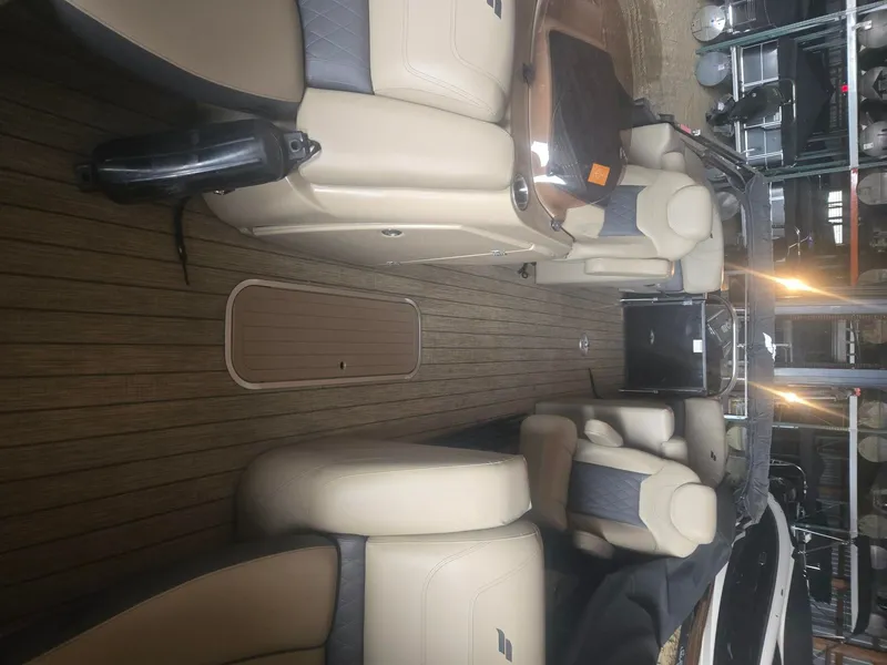 Slide: The Image of Interior of a 2022 Starcraft SLS3 Tritoon with luxurious seating. - 10
