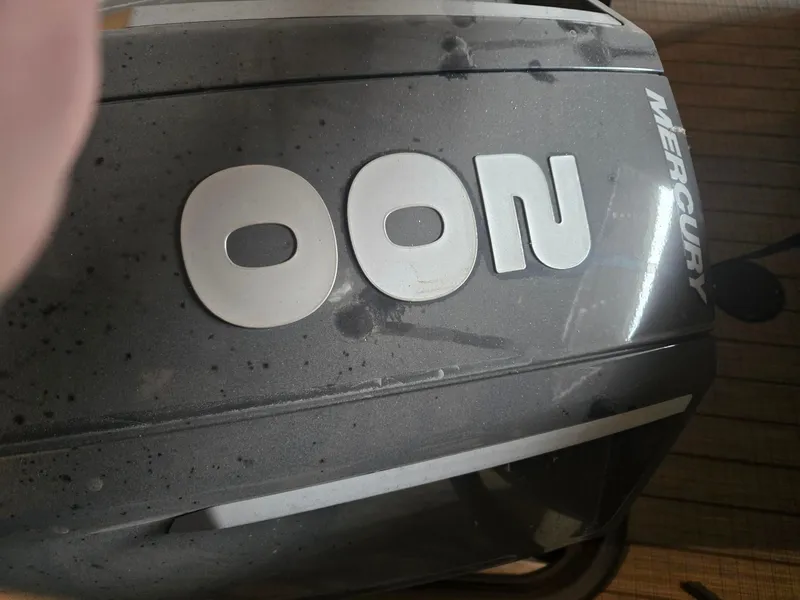 Slide: The Image of Starcraft SLS3 Tritoon 2022 engine cover with Mercury logo. - 8