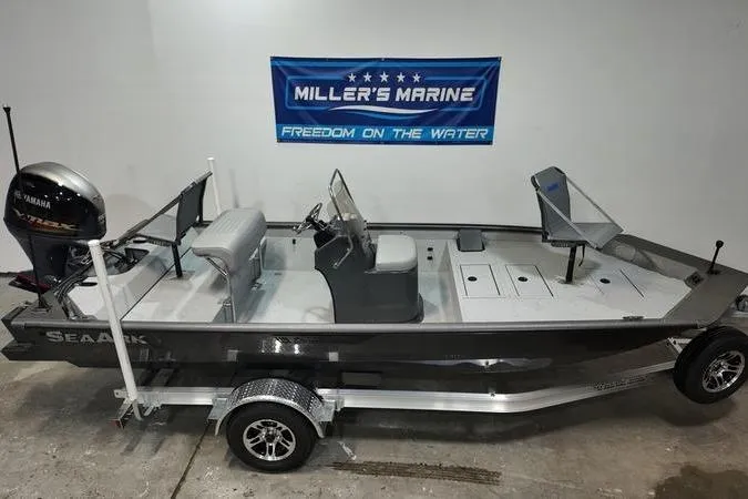 Slide: The Image of 2025 SeaArk Shadow 18T boat with Yamaha motor, displayed at Miller's Marine showroom. - 1