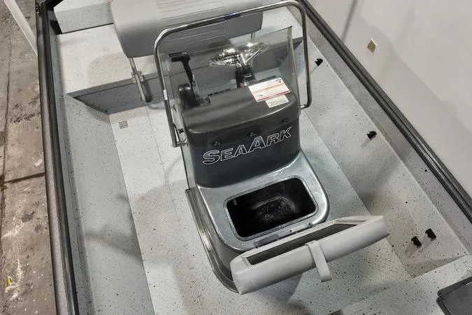 Slide: The Image of 2025 SeaArk Shadow 18T boat interior with console and seating. - 13