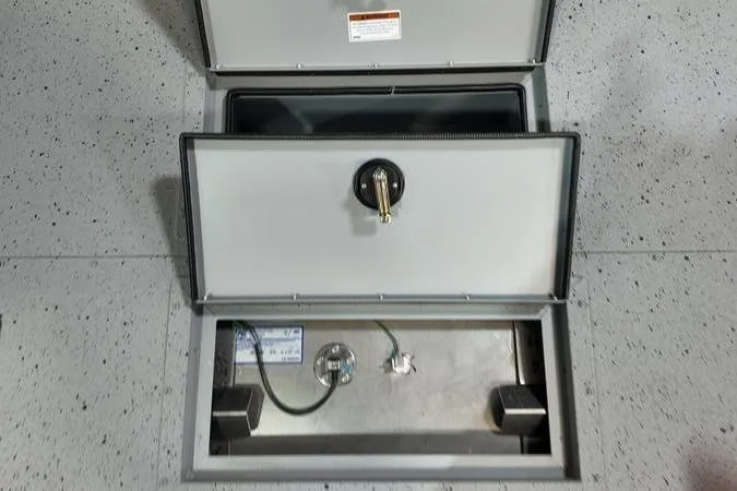 Slide: The Image of 2025 SeaArk Shadow 18T boat storage compartments with secure latches and wiring. - 15