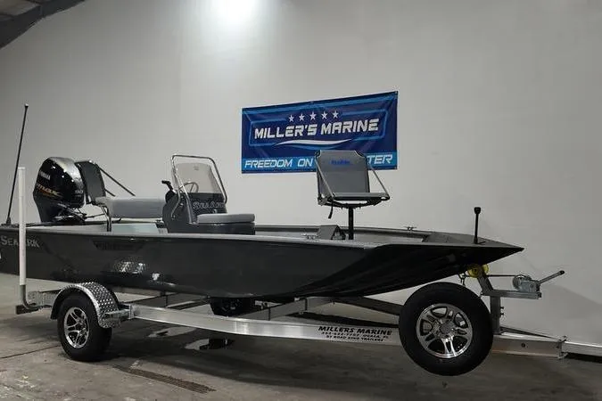 Slide: The Image of 2025 SeaArk Shadow 18T boat on trailer at Miller's Marine showroom. - 2