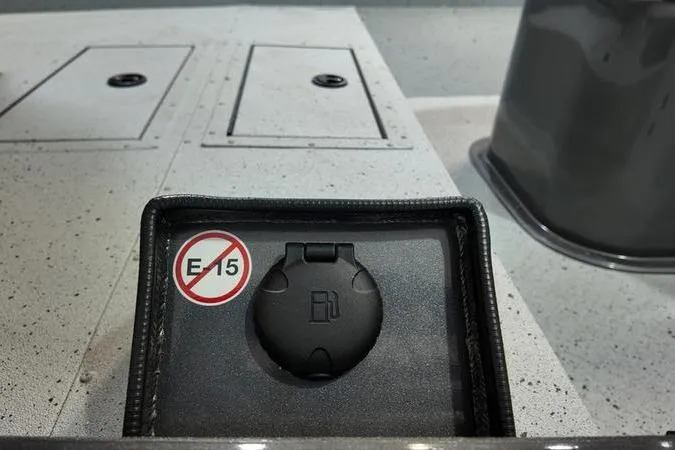 Slide: The Image of Fuel cap with E15 warning on 2025 SeaArk Shadow 18T boat deck. - 20