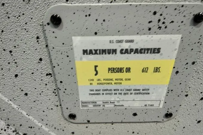 Slide: The Image of SeaArk Shadow 18T 2025 capacity plate: 5 persons or 612 lbs, 86 horsepower motor. - 22