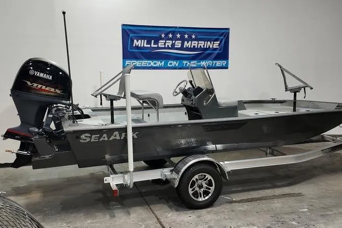 Slide: The Image of 2025 SeaArk Shadow 18T boat with Yamaha engine on trailer at Miller's Marine showroom. - 5