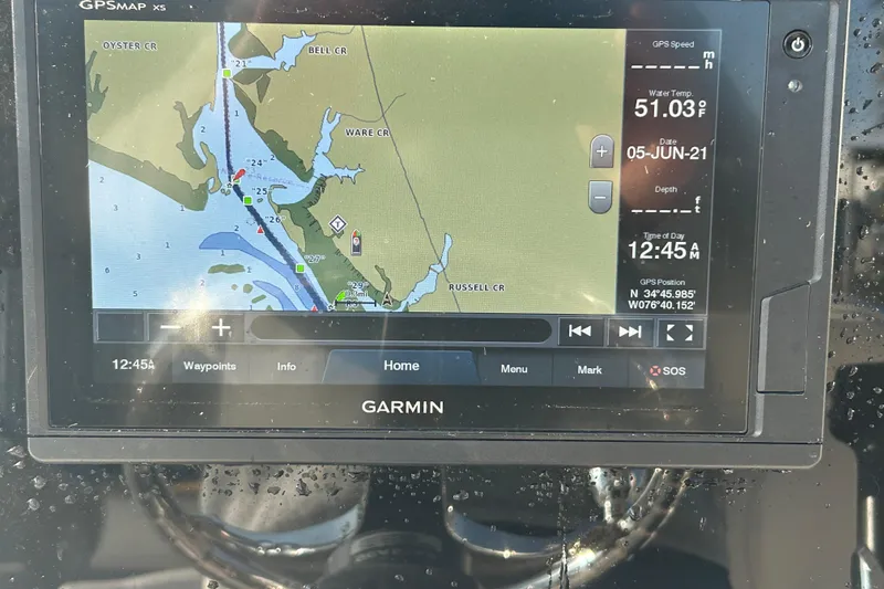 Slide: The Image of Garmin GPS display on 2019 Sea Hunt Ultra 211, showing map and navigation details. - 13