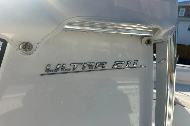 Slide: The Image of 2019 Sea Hunt Ultra 211 boat emblem with water droplets. - 30