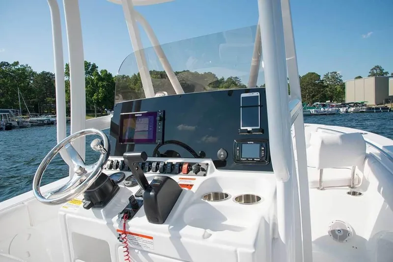 Slide: The Image of 2019 Sea Hunt Ultra 211 boat on trailer in parking lot, sunny day. - 4