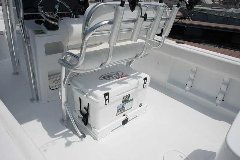 Slide: The Image of 2019 Sea Hunt Ultra 211 boat on trailer under clear blue sky. - 5