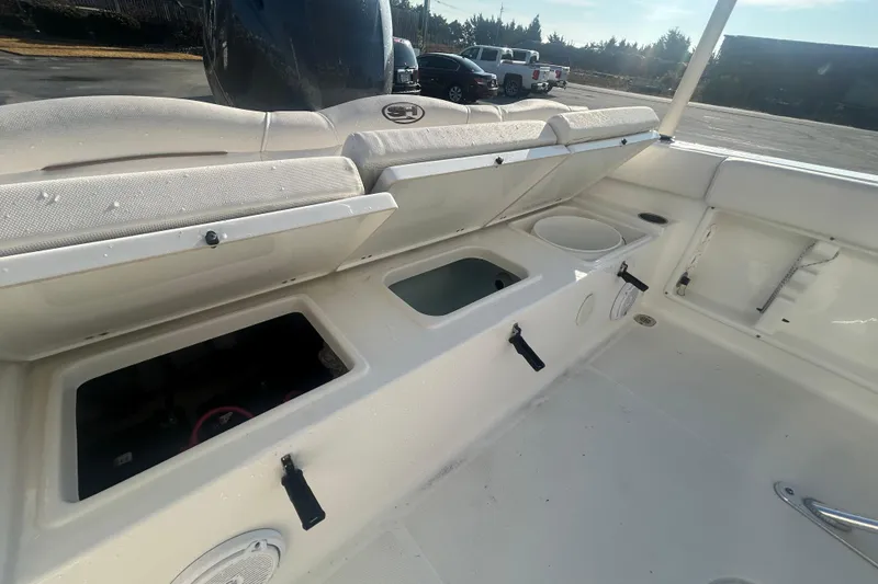 Slide: The Image of 2019 Sea Hunt Ultra 211 boat interior with open storage compartments. - 8