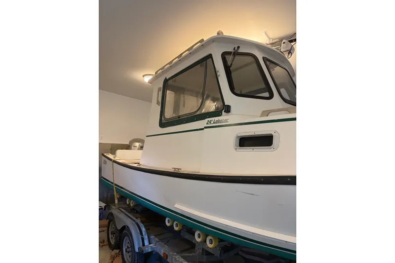 Slide: The Image of 2007 Eastern 24 Lobster boat in garage, side view. - 3