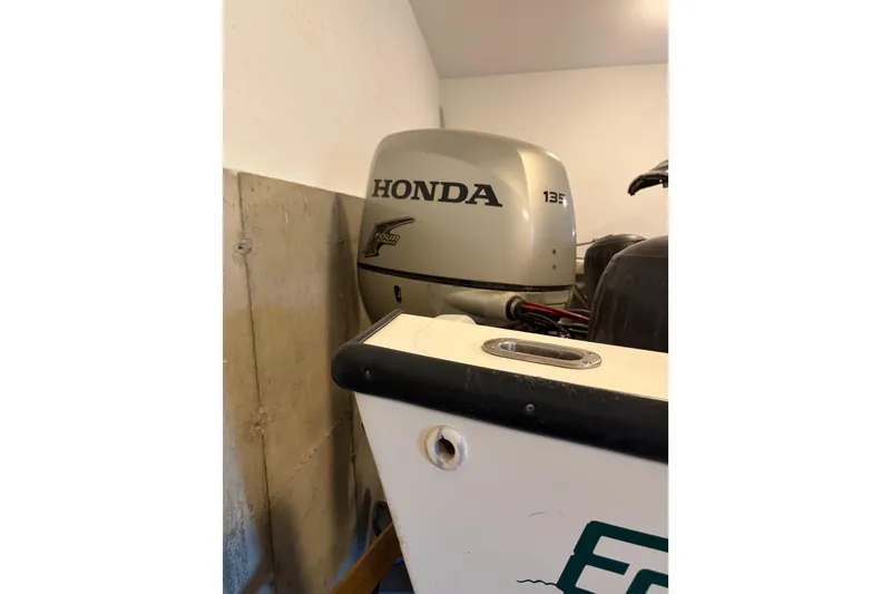 Slide: The Image of 2007 Eastern 24 Lobster boat with Honda 135 outboard motor in garage. - 4