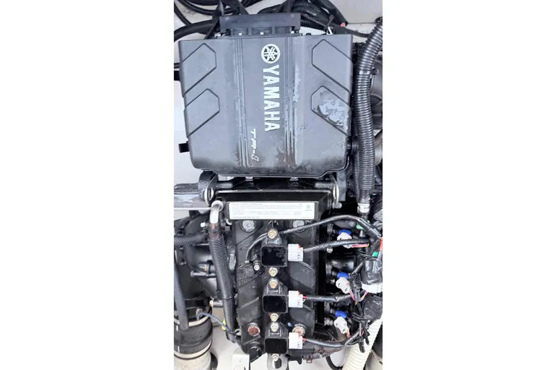 Slide: The Image of 2019 Yamaha AR210 engine with visible wiring and components. - 11