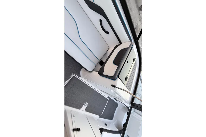 Slide: The Image of 2019 Yamaha Boats AR210 interior seating with sleek design and modern upholstery. - 12