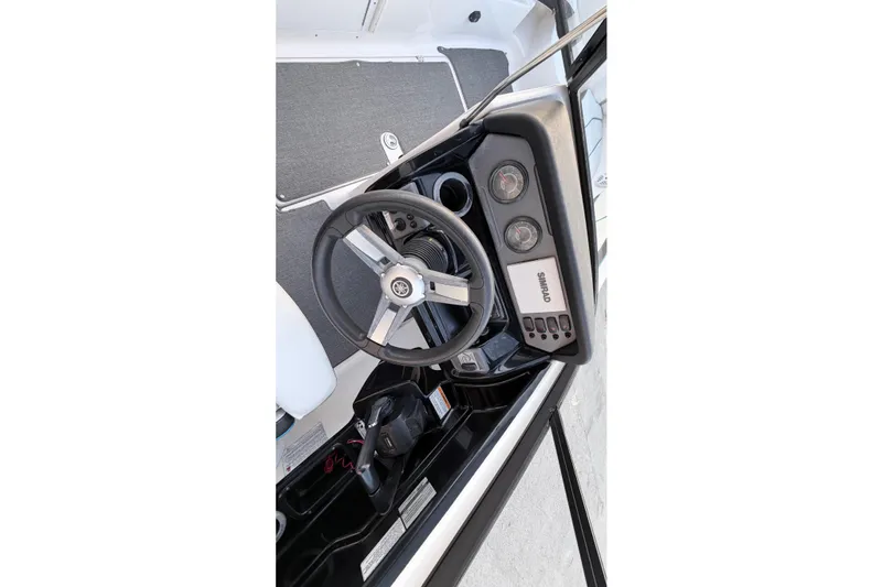 Slide: The Image of Yamaha AR210 2019 boat dashboard with steering wheel and gauges. - 13
