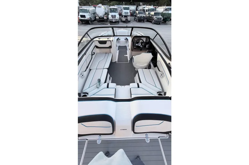 Slide: The Image of 2019 Yamaha AR210 boat interior with spacious seating and modern dashboard. - 8