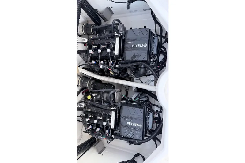 Slide: The Image of 2019 Yamaha AR210 boat engines, showcasing dual Yamaha motors in a clean engine compartment. - 9