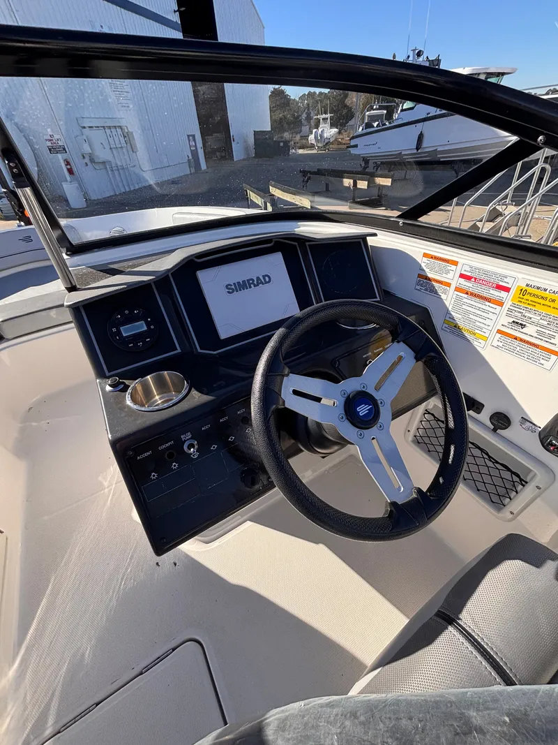 Slide: The Image of 2024 Bayliner VR6 Bowrider OB cockpit with Simrad display. - 7