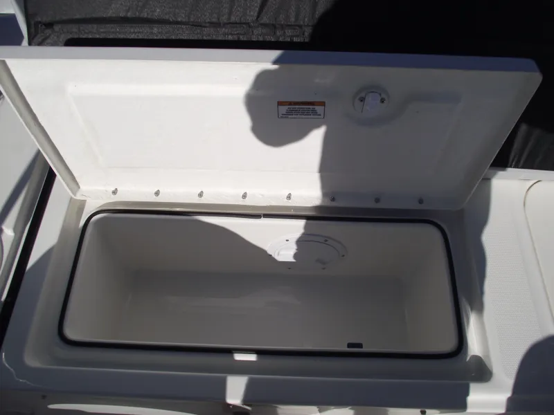 Slide: The Image of 2024 Bayliner Element M19 boat storage compartment with open lid. - 10
