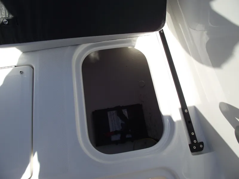 Slide: The Image of 2024 Bayliner Element M19 storage compartment with battery. - 11