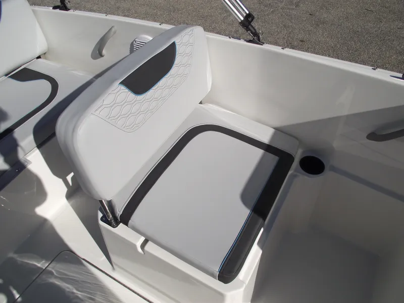 Slide: The Image of 2024 Bayliner Element M19 boat seat with white and black upholstery. - 14