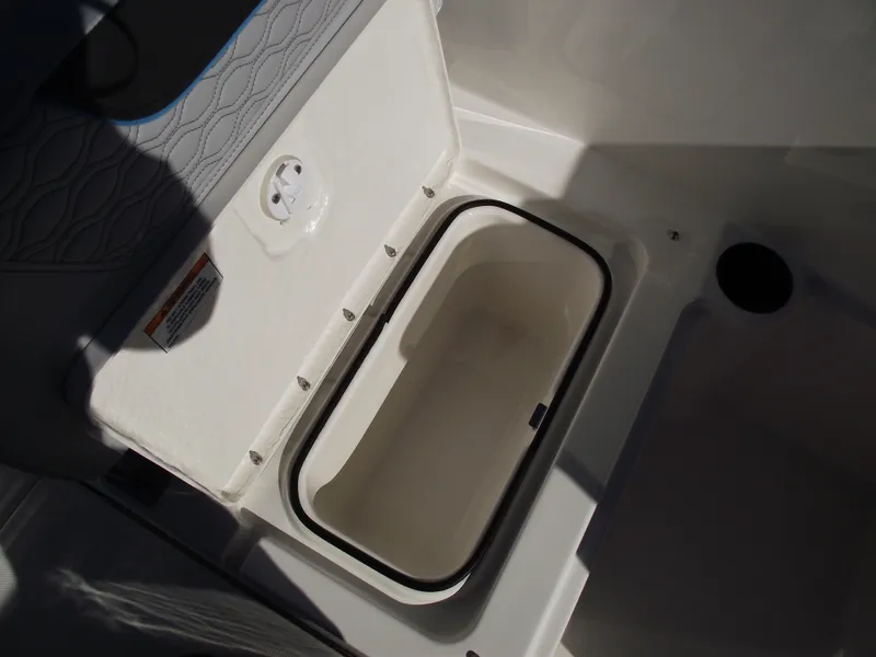 Slide: The Image of 2024 Bayliner Element M19 boat storage compartment with open lid. - 15