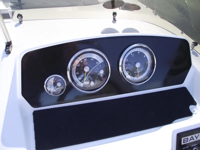Slide: The Image of Dashboard of 2024 Bayliner Element M19 boat with gauges and controls. - 18