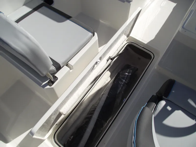 Slide: The Image of 2024 Bayliner Element M19 boat interior storage compartment and seating. - 21