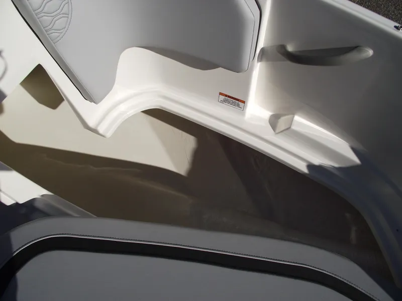 Slide: The Image of Interior detail of 2024 Bayliner Element M19 boat, showcasing seating and storage area. - 24
