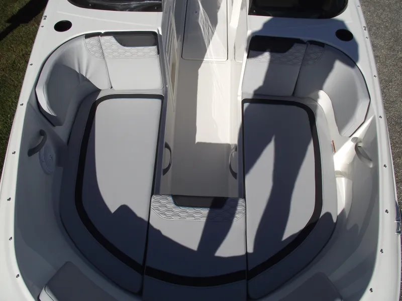 Slide: The Image of 2024 Bayliner Element M19 boat interior with cushioned seating. - 29