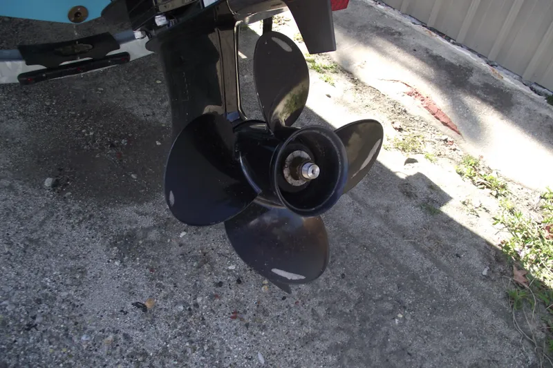 Slide: The Image of 2024 Bayliner Element M19 boat propeller on concrete surface. - 4