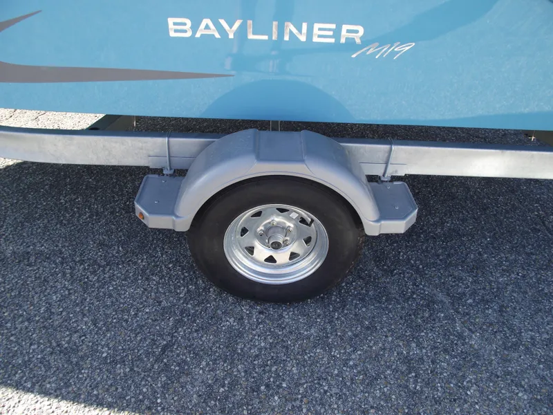 Slide: The Image of 2024 Bayliner Element M19 boat trailer wheel and fender. - 6