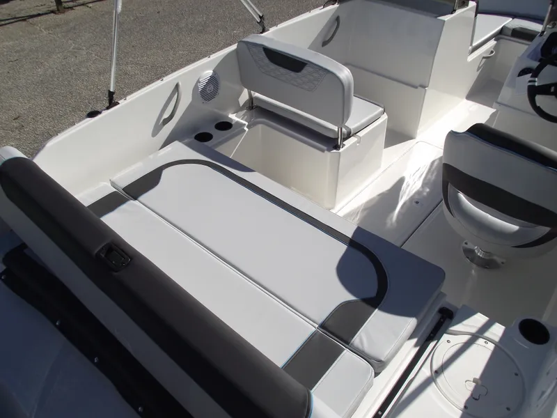 Slide: The Image of 2024 Bayliner Element M19 boat interior with seating and storage compartments. - 7