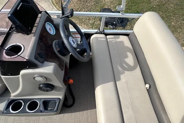 Slide: The Image of 2020 Sun Tracker Bass Buggy 16 DLX interior with steering console and seating. - 10