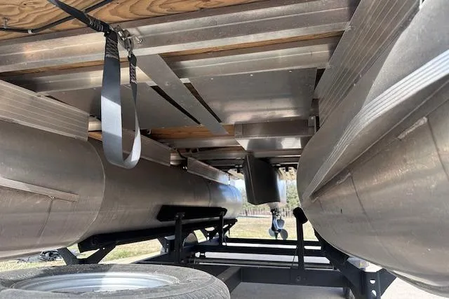 Slide: The Image of Underneath view of a 2020 Sun Tracker Bass Buggy 16 DLX pontoon boat on a trailer. - 22