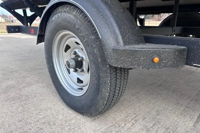 Slide: The Image of Trailer wheel of 2020 Sun Tracker Bass Buggy 16 DLX on concrete surface. - 24