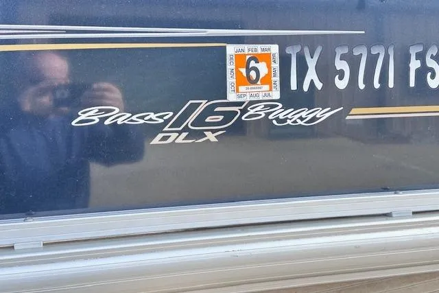 Slide: The Image of 2020 Sun Tracker Bass Buggy 16 DLX boat with registration sticker and reflection. - 30