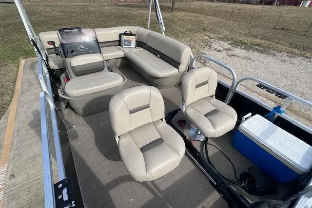 Slide: The Image of 2020 Sun Tracker Bass Buggy 16 DLX pontoon boat interior with seating and cooler. - 5